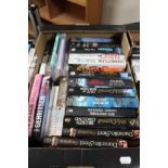 A box of paperback books