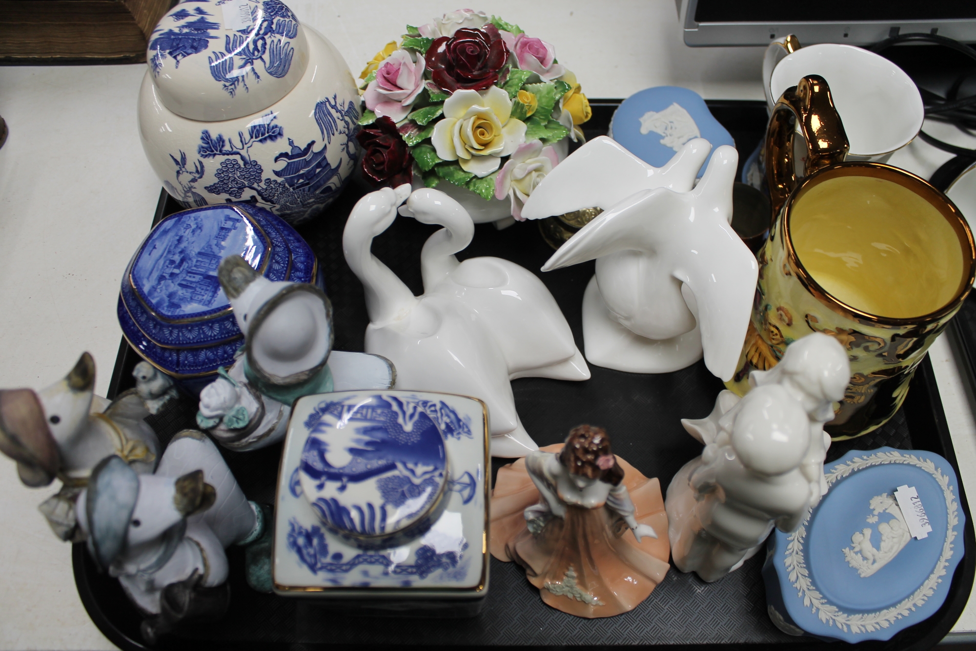 A tray of china ornaments, Doulton figures,