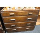 An early twentieth century oak four drawer chest
