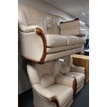 A three piece leather lounge suite with footstool