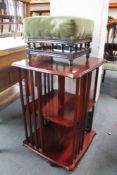 An Edwardian footstool together with a mahogany revolving book stand