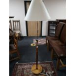 A mid 20th century teak standard lamp and shade