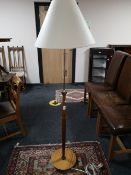 A mid 20th century teak standard lamp and shade