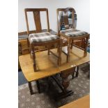 An early 20th century oak six piece dining room suite