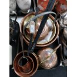 A tray of antique and later copper, saucepans,