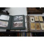 Two albums of postcards and antique portrait pictures