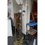 A collection of seven floor lamps - examples in brass,