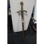 A reproduction long sword in scabbard