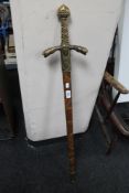 A reproduction long sword in scabbard