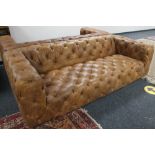 A brown studded leather Chesterfield style settee CONDITION REPORT: This is a pair