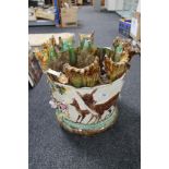 An encrusted potter planter decorated with fawns etc