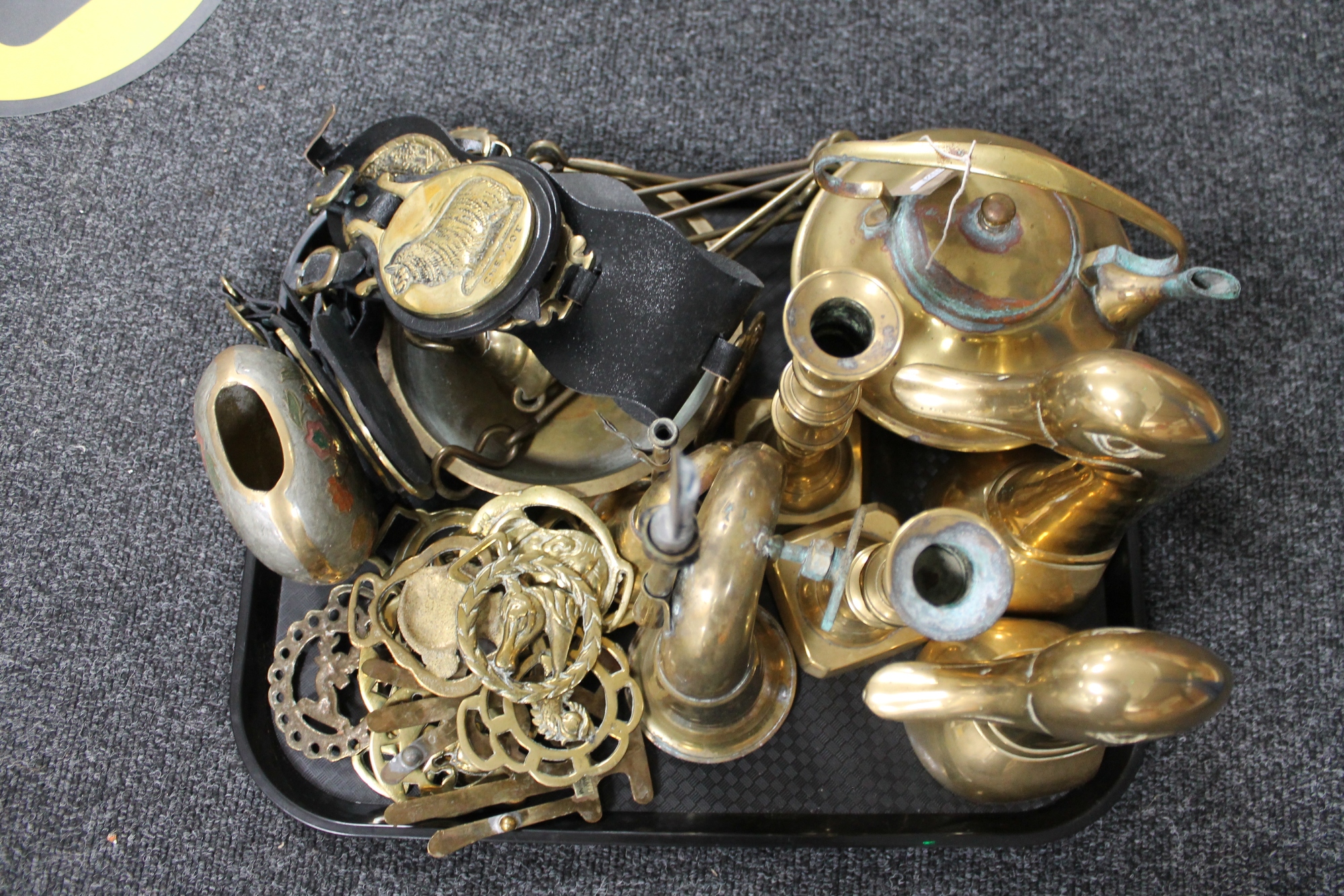 A tray of brass candlesticks, pair of duck figures,