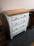 A contemporary five drawer chest with oak top