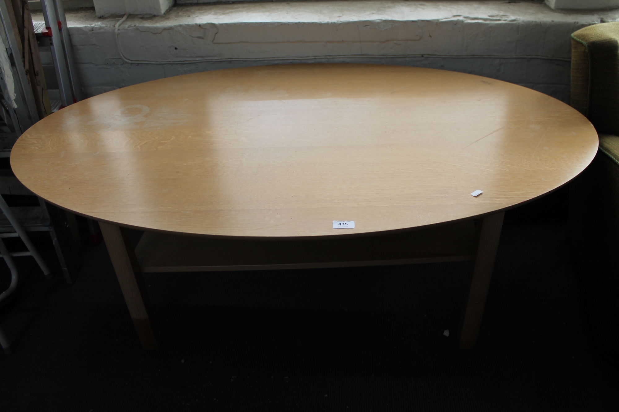 A light oak oval coffee table