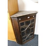 An Edwardian stained pine corner cabinet