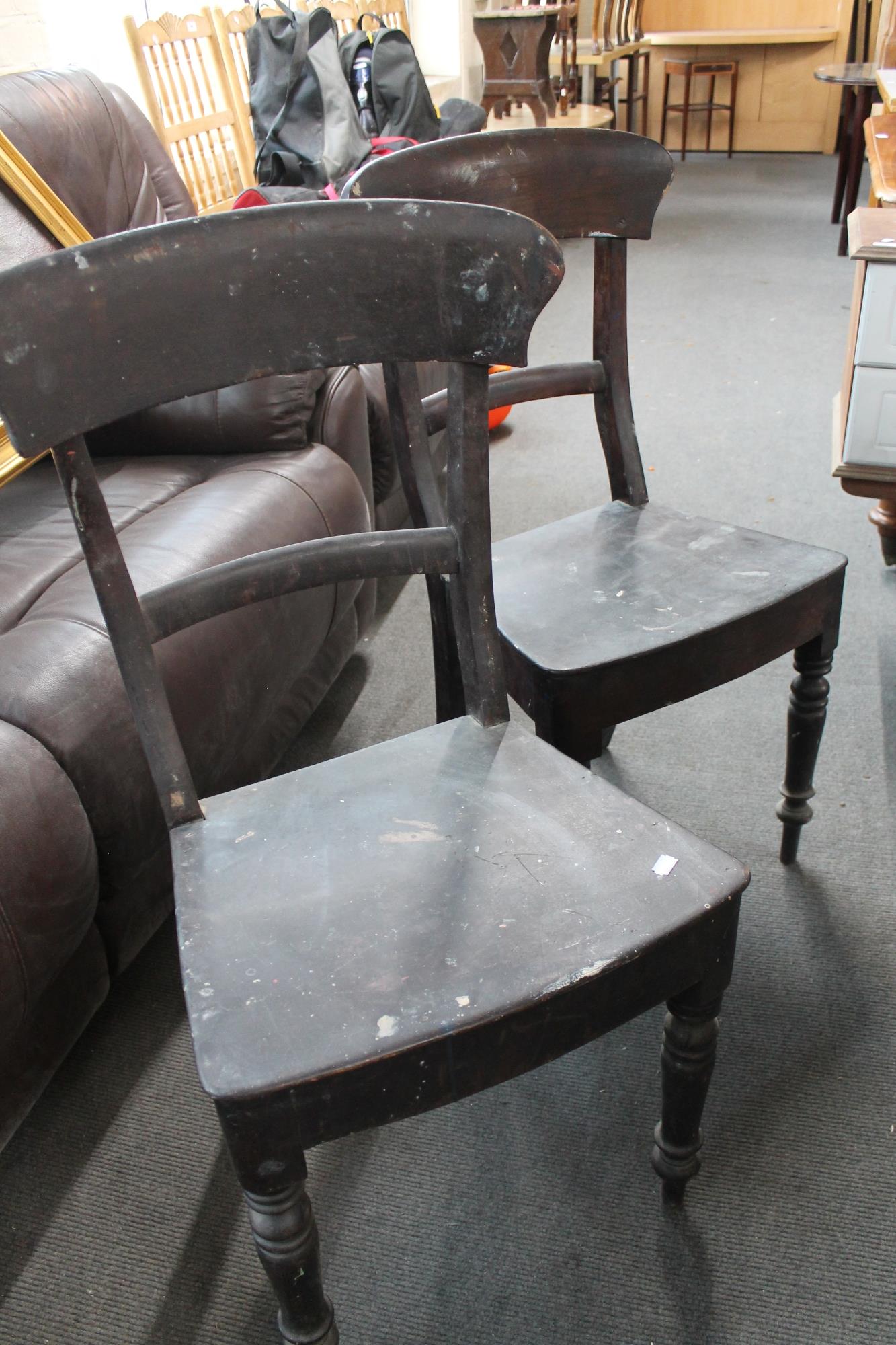 A pair of antique dining chairs
