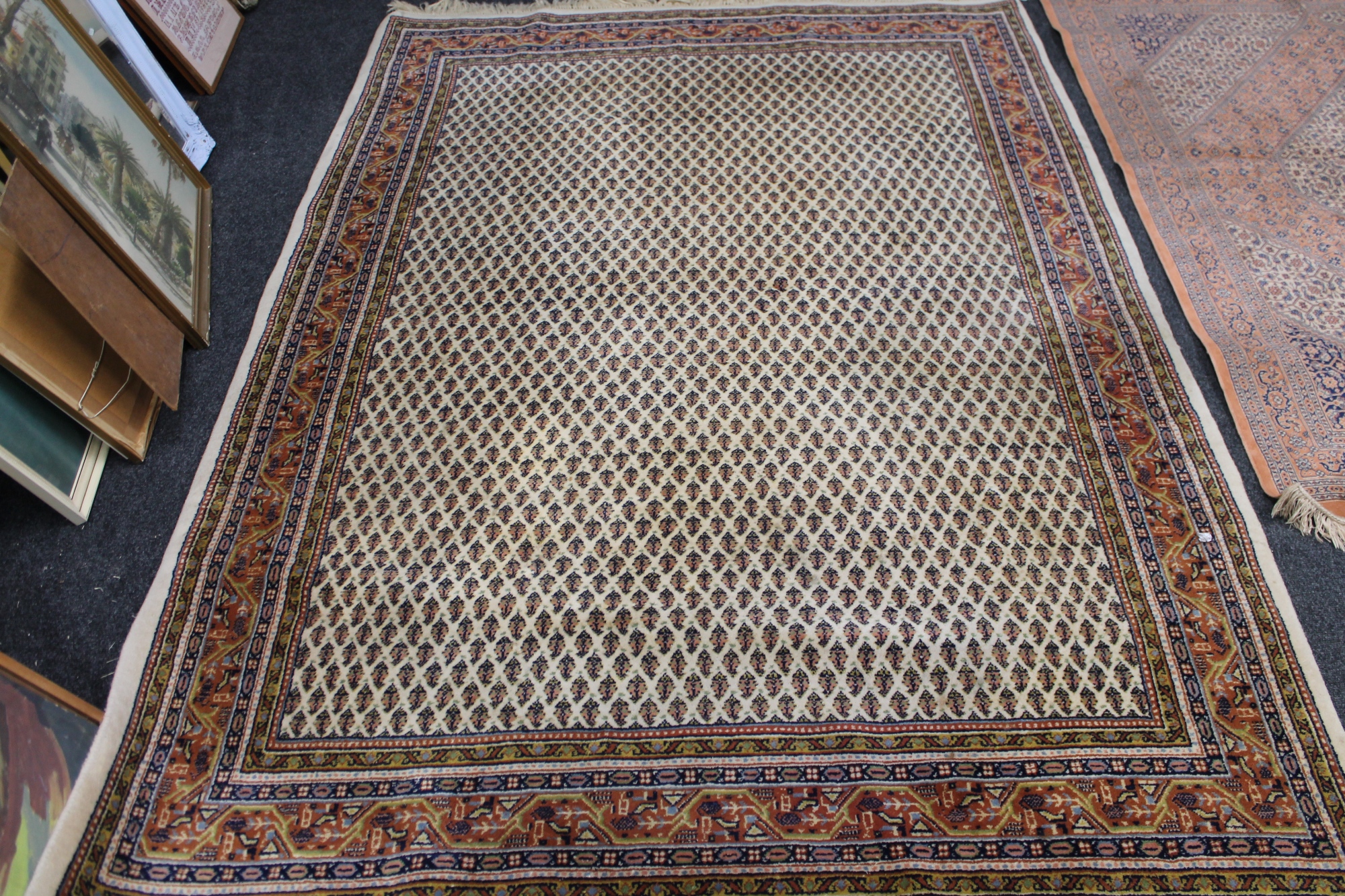 A fringed eastern carpet of geometric design