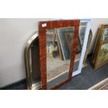An overmantel mirror together with an antique style mirror,