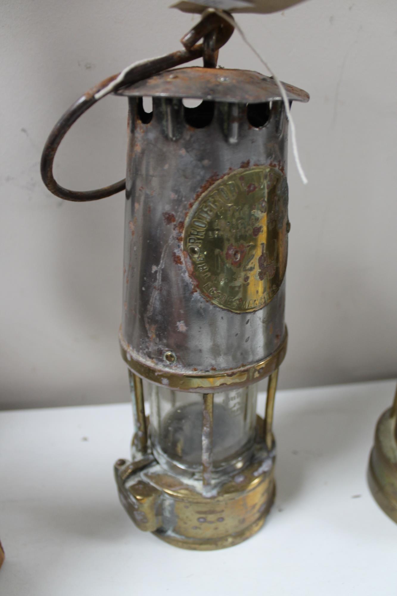 A brass miner's lamp by Eccles