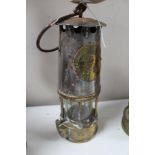 A brass miner's lamp by Eccles