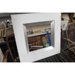 A white contemporary framed mirror CONDITION REPORT: This is 89cm by 89cm by 7.