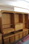 A multi section teak effect wall unit