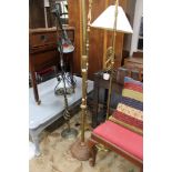 Four brass and metal floor lights