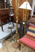 Four brass and metal floor lights