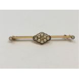 A yellow metal (tests 15ct gold) pearl and diamond brooch, 3.52g.