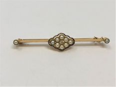 A yellow metal (tests 15ct gold) pearl and diamond brooch, 3.52g.