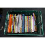 A plastic crate of children's annuals,