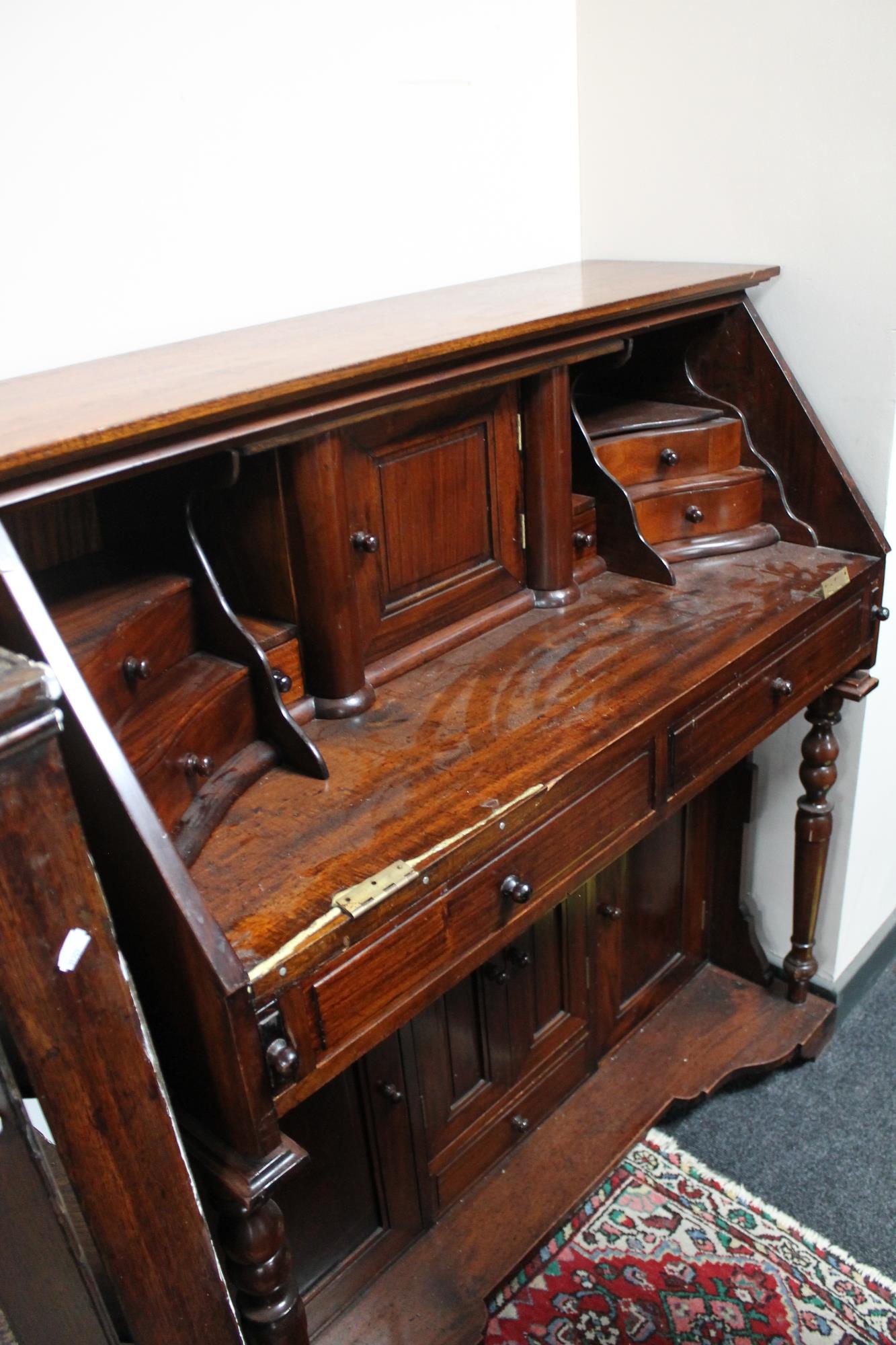 A reproduction mahogany desk