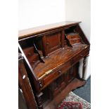 A reproduction mahogany desk