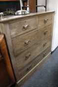 An Edwardian oak five drawer chest