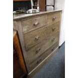 An Edwardian oak five drawer chest