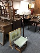 A folding tray table together with footstool and standard lamp