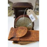 A calendar desk stand, barometer and compass,