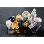 A tray of cottage tea pots, coronation beaker,