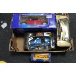 A box of die cast vehicles,