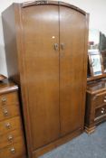 An early twentieth century oak double door wardrobe