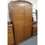 An early twentieth century oak double door wardrobe