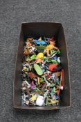 A box of plastic toy figures,