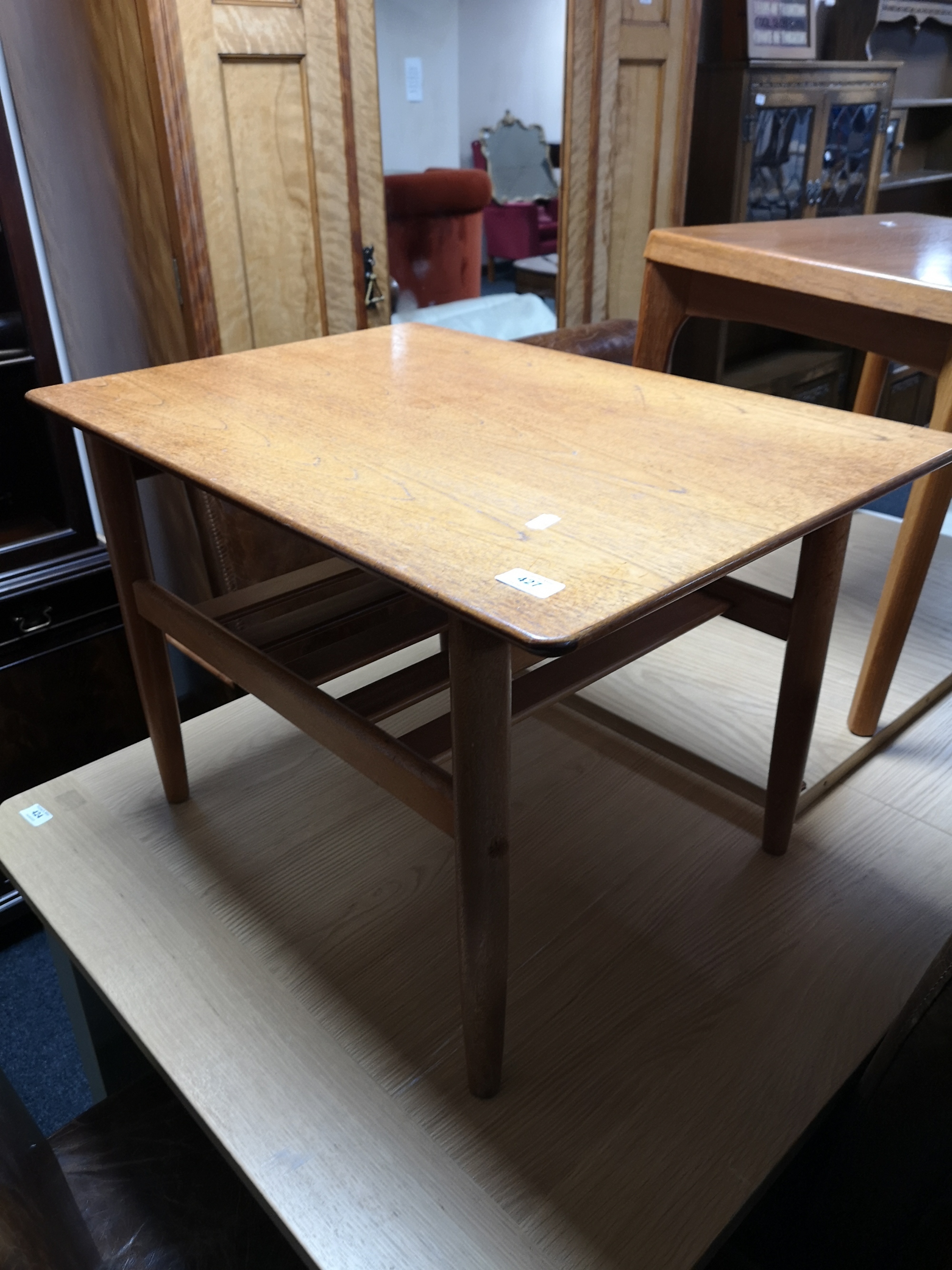 A teak low table and a further occasional table