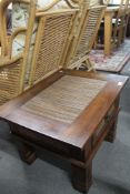 A cane topped lamp table fitted with a drawer