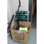 Two folding patio chairs together with a boxed Polti steam cleaner and vac