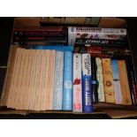 A box of hardback and paperback books; novels to include James Patterson,