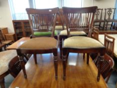 A set of thirteen early twentieth century mahogany dining chairs with comb backs.