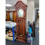 A reproduction grandfather clock with pendulum and weights (front door lacking glass pane)