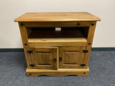 A Mexican pine double door cupboard