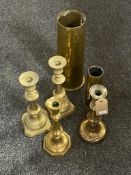 Two brass shells together with pair of brass candlesticks and two further brass candlesticks